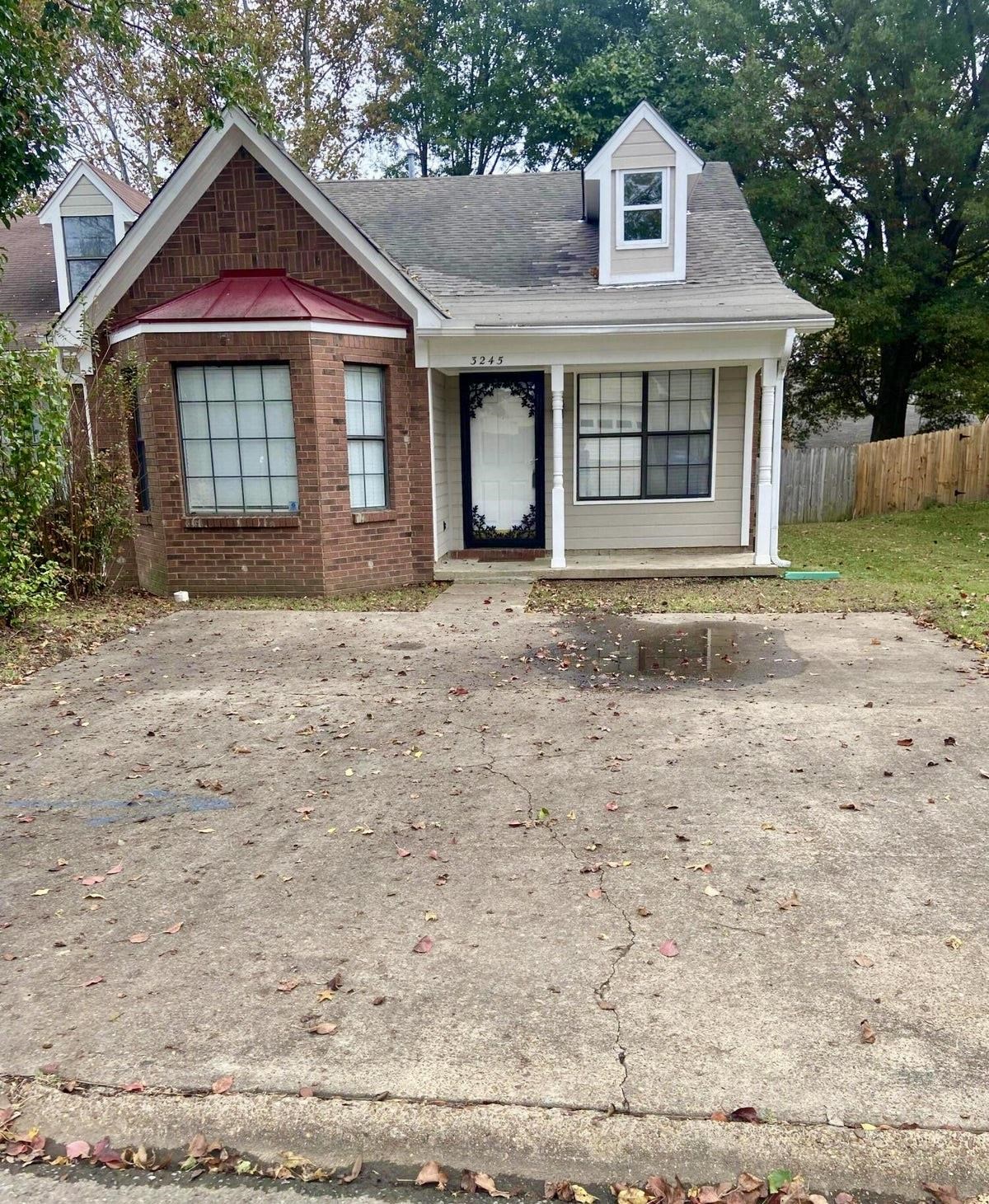 a front view of a house with yard