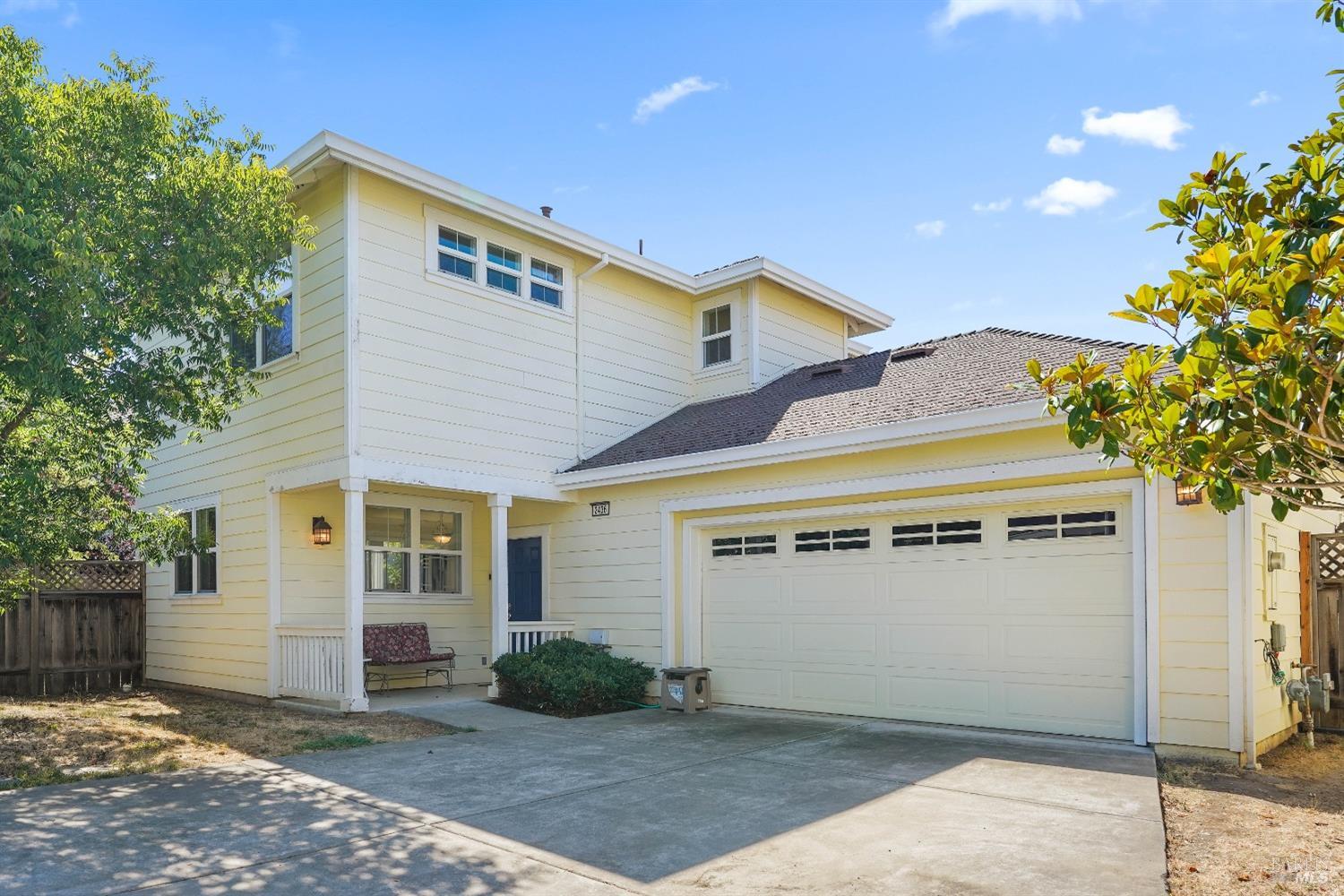 a front view of a house with a garage