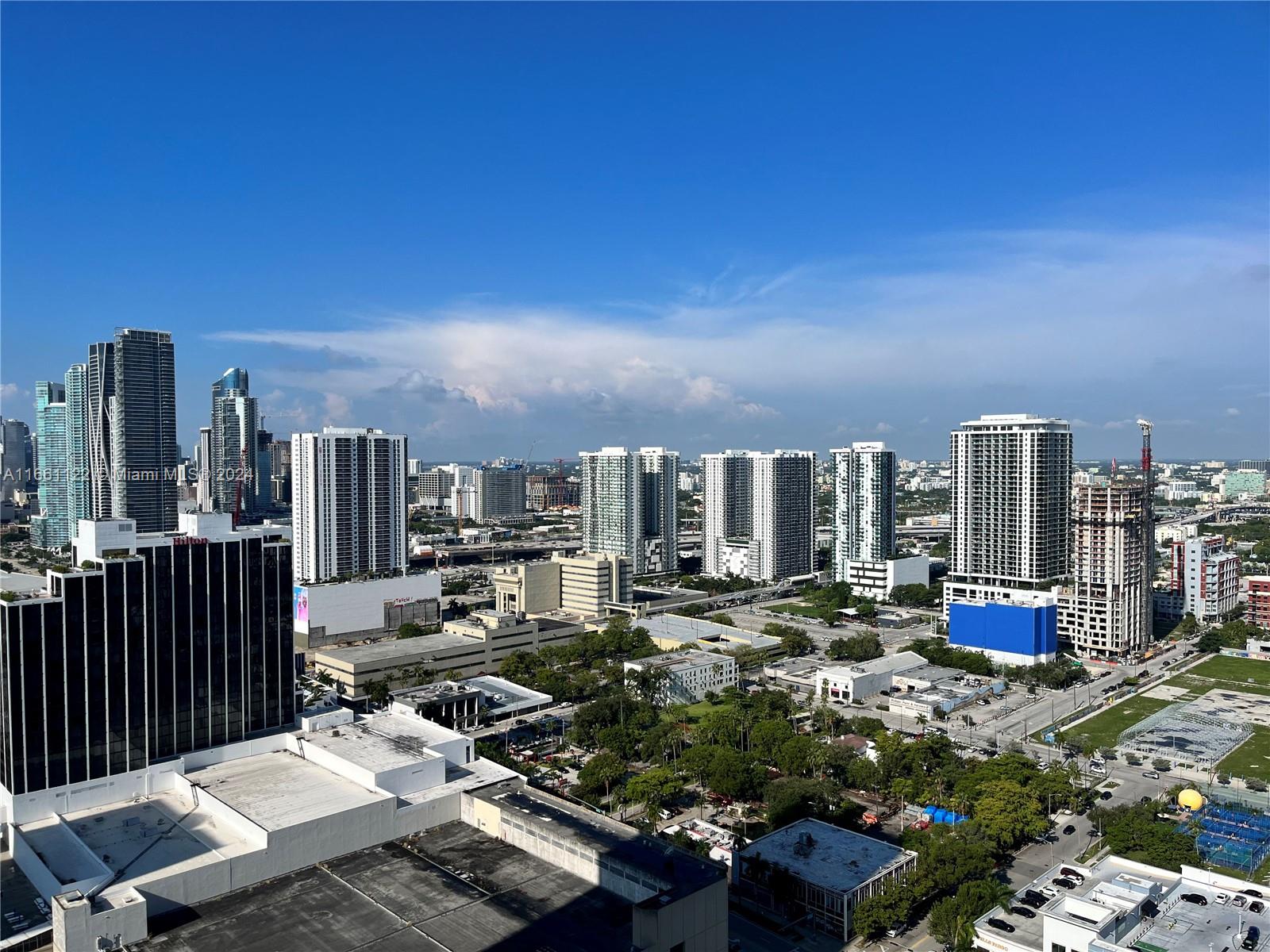 a view of a city with tall buildings