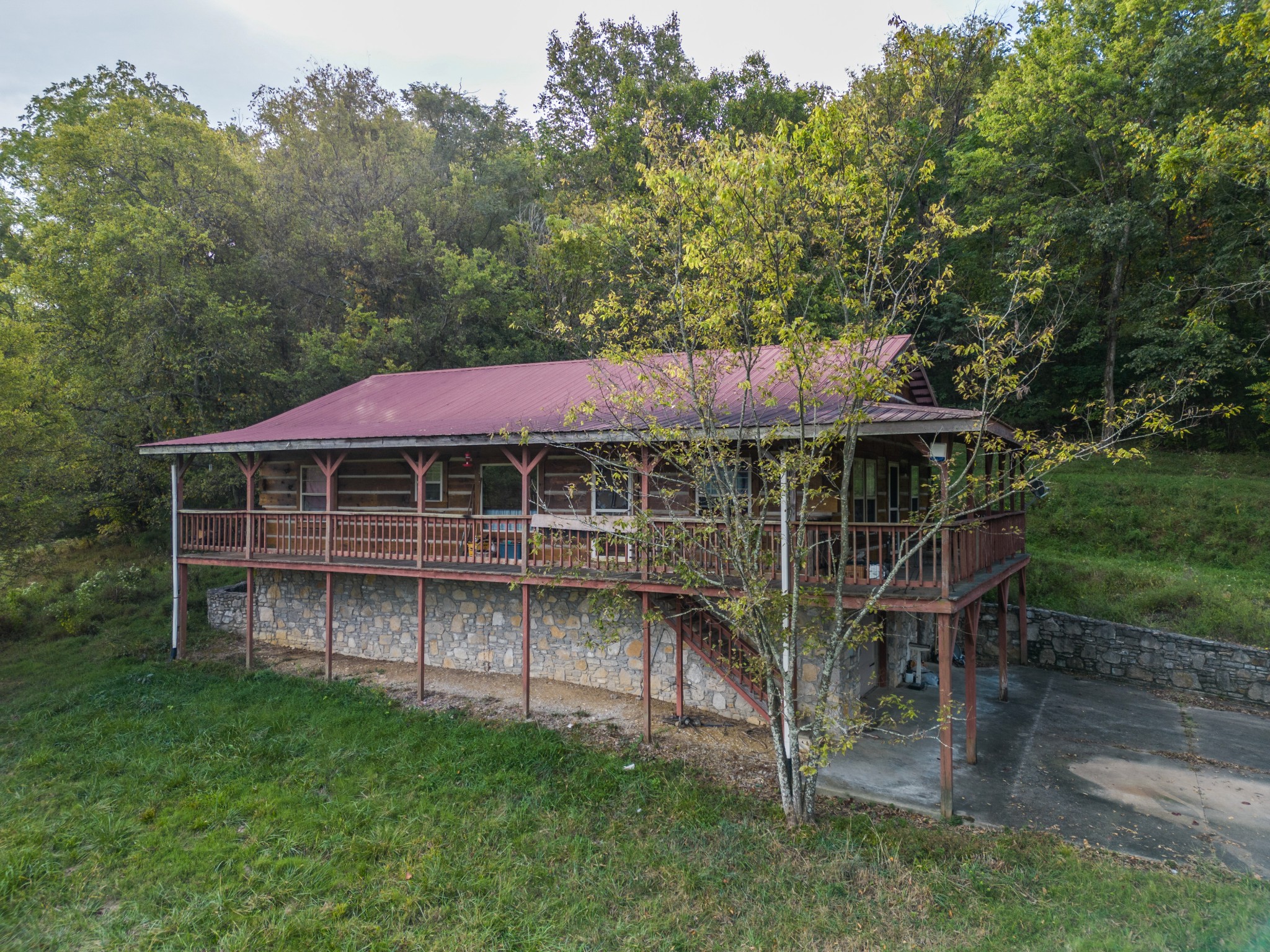 an outdoor view of house with swimming pool and furniture