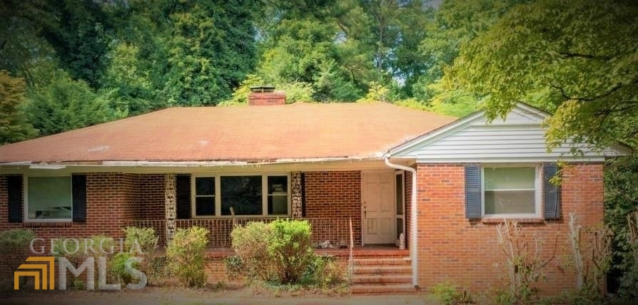 a house with a tree in front of it