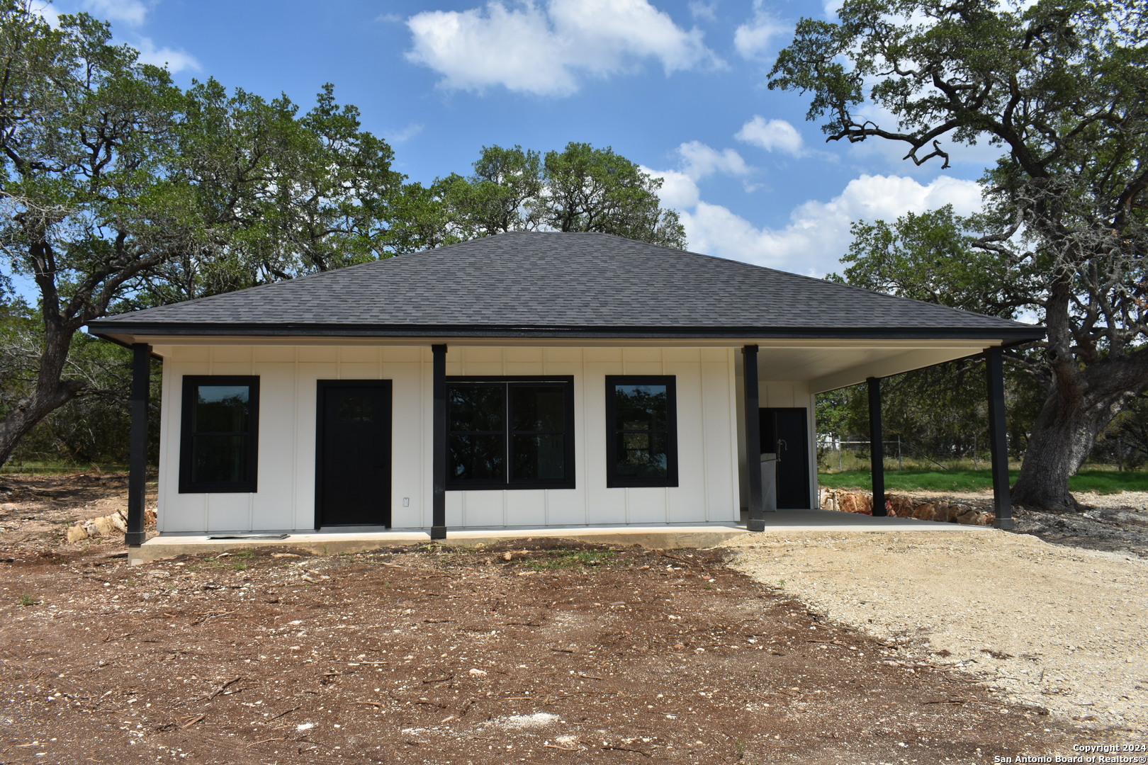 front view of a house with a yard