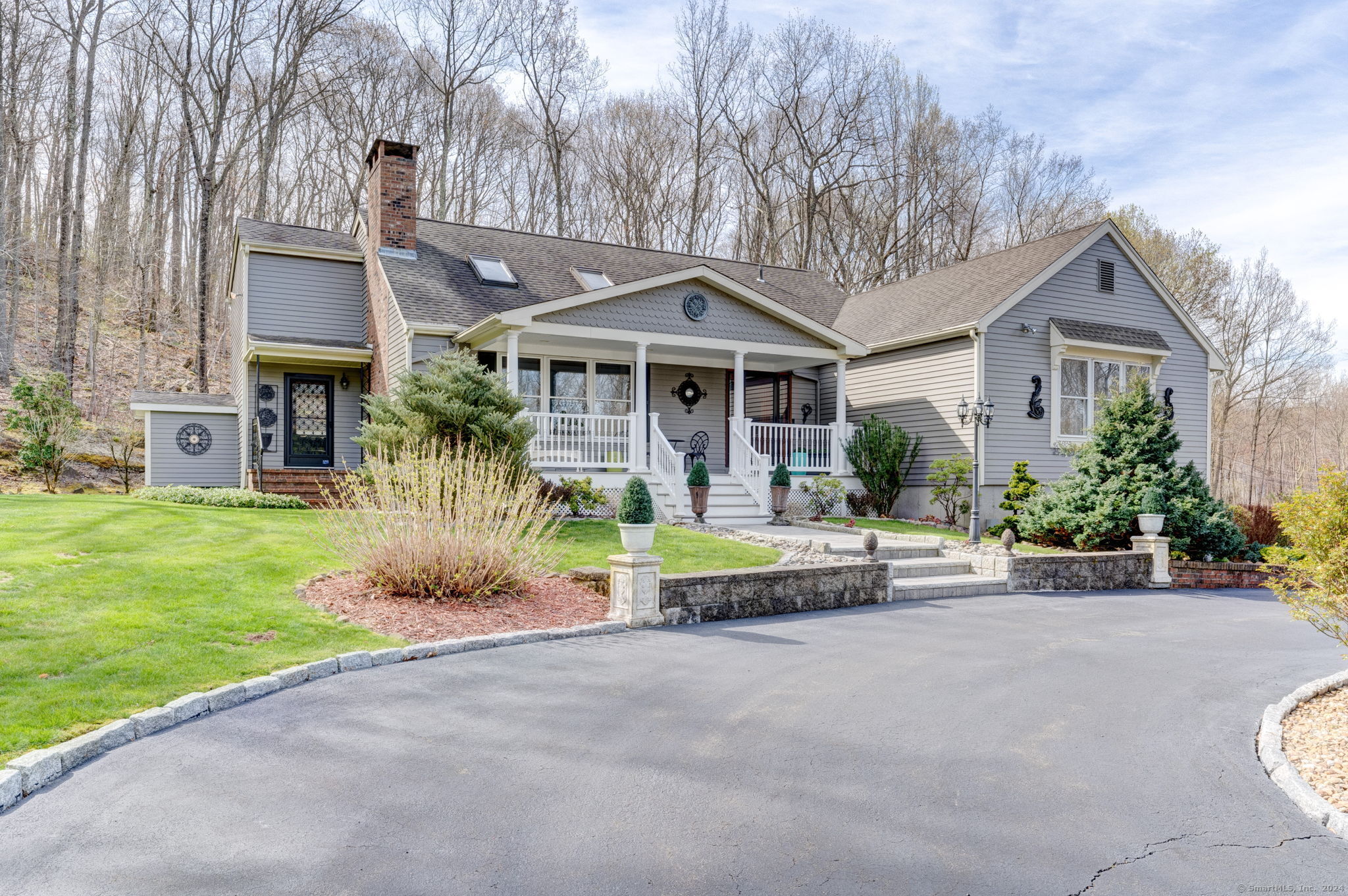 a front view of house with yard and green space