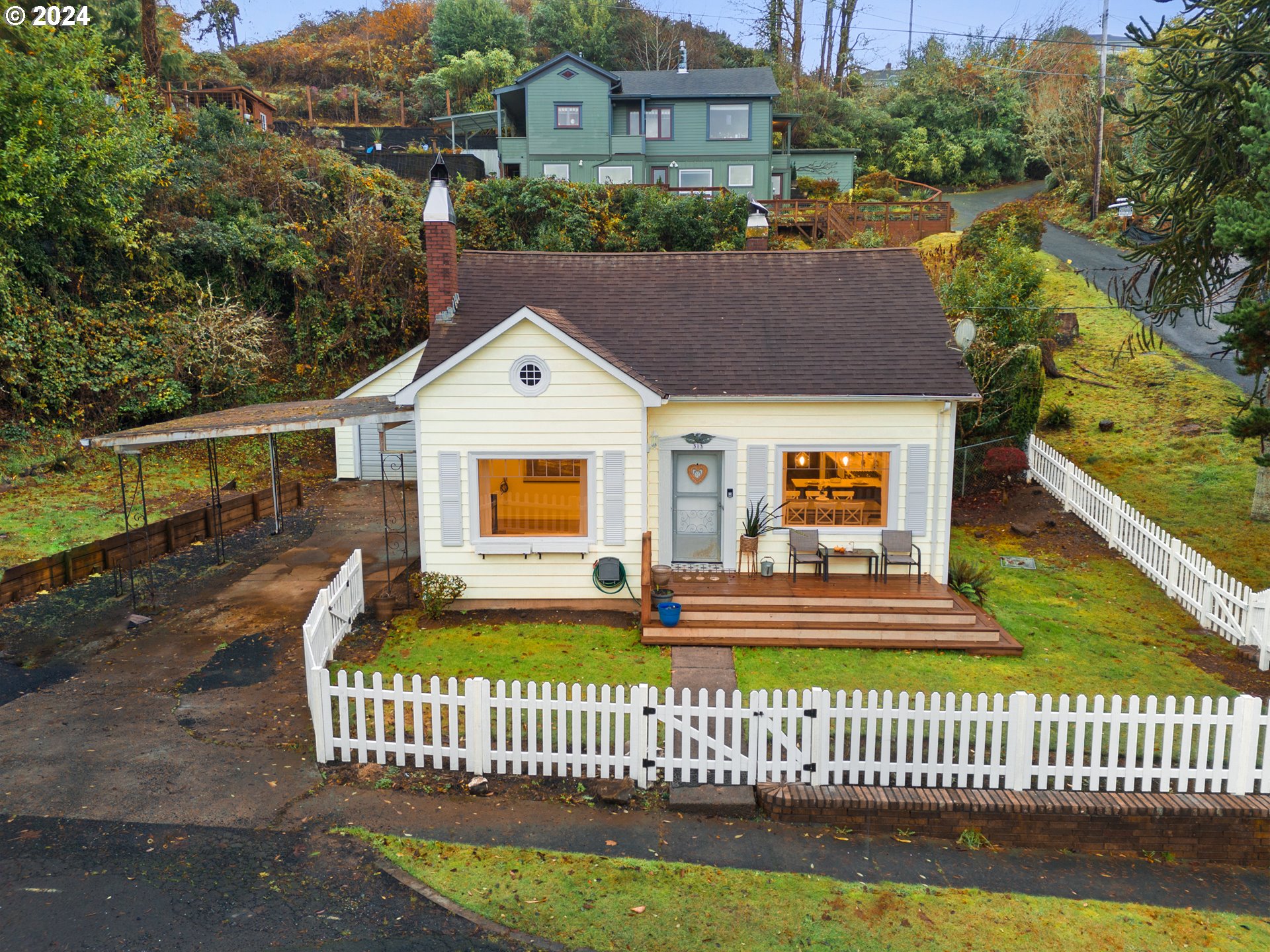 a front view of a house with a garden