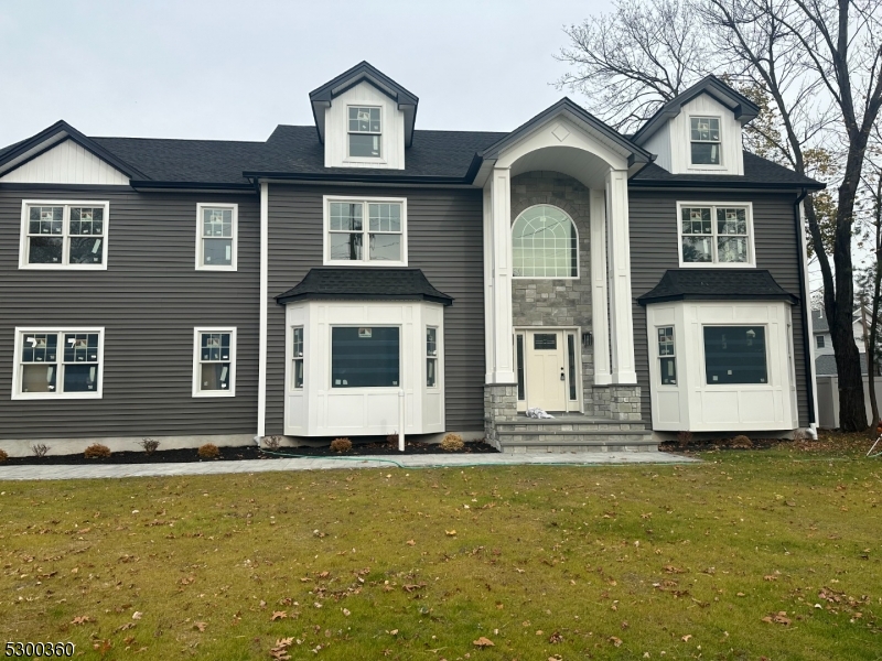 a front view of a house with yard