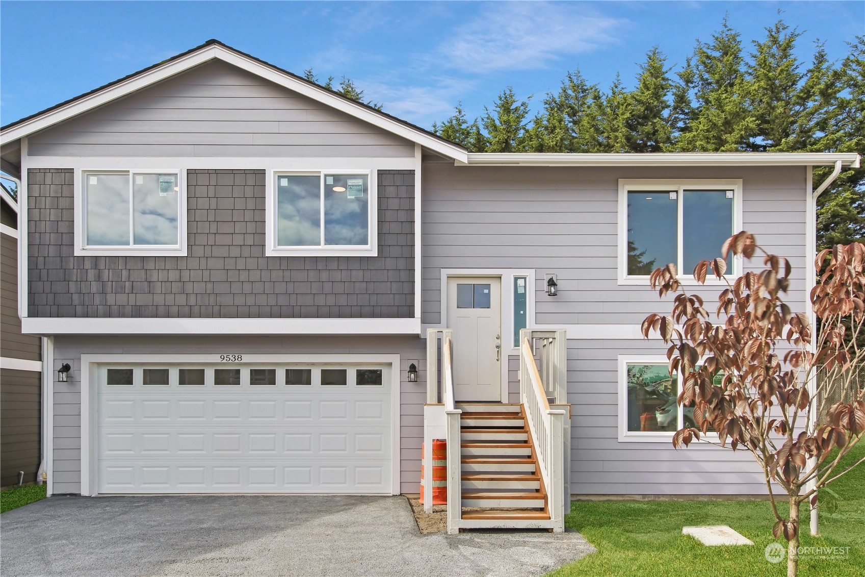 a front view of a house with a yard