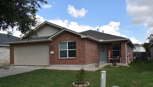 a view of an house with backyard space and garden