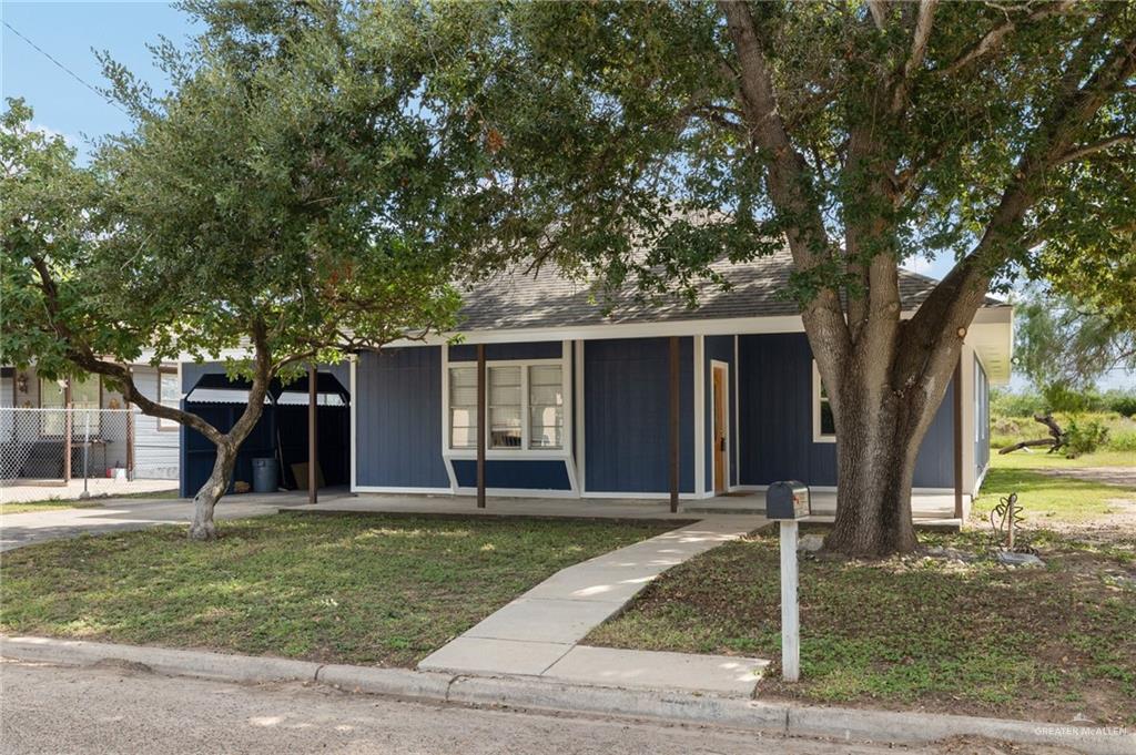 front view of a house with a yard