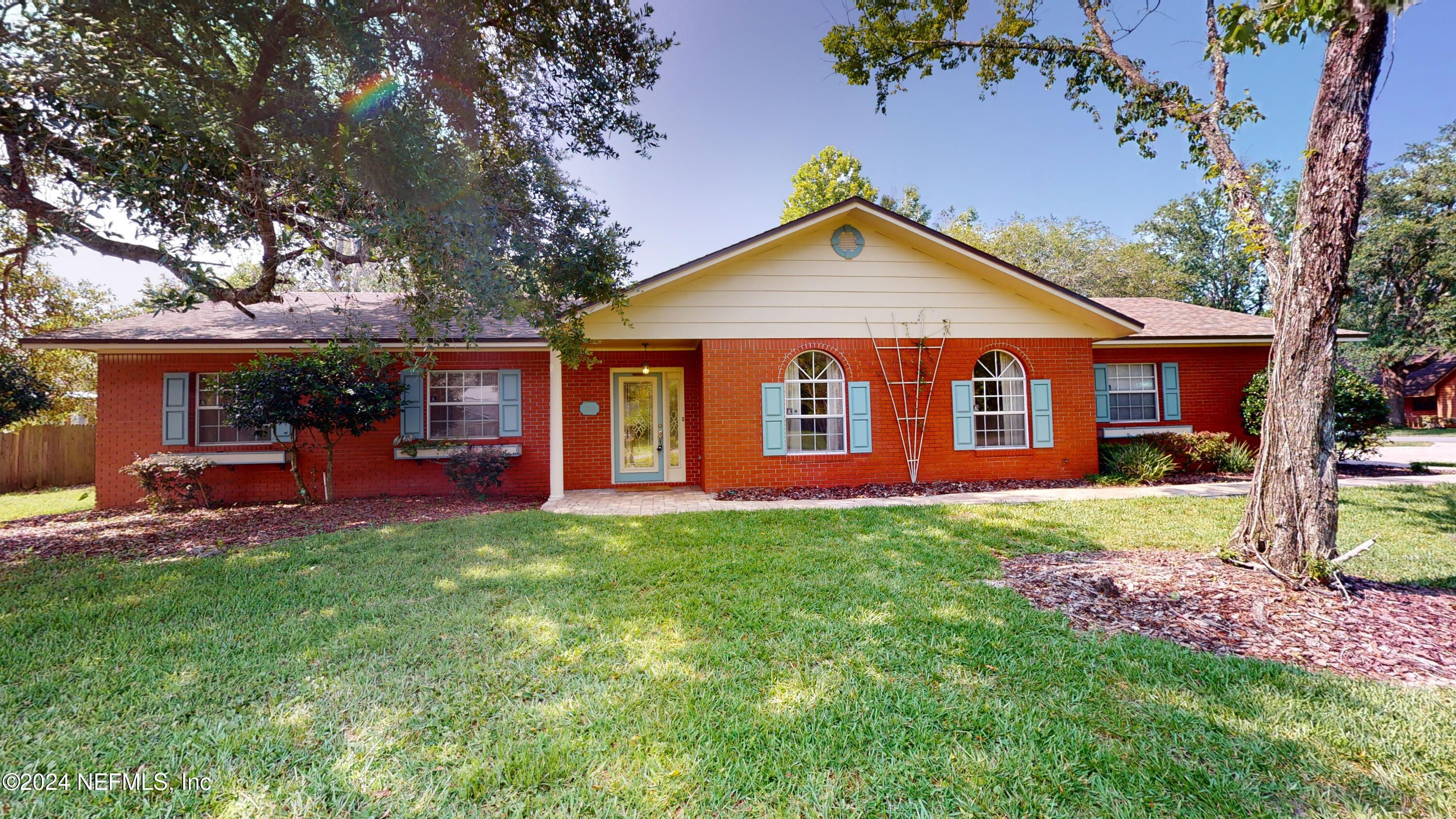 front view of a house with a yard