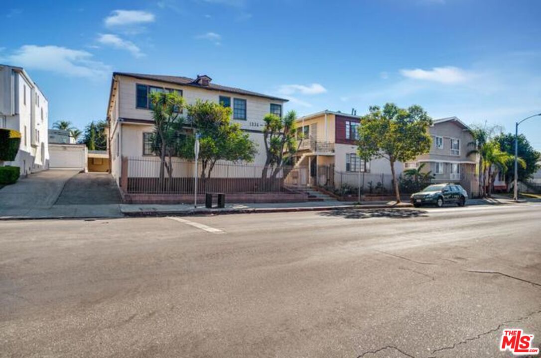 a view of a house with a street