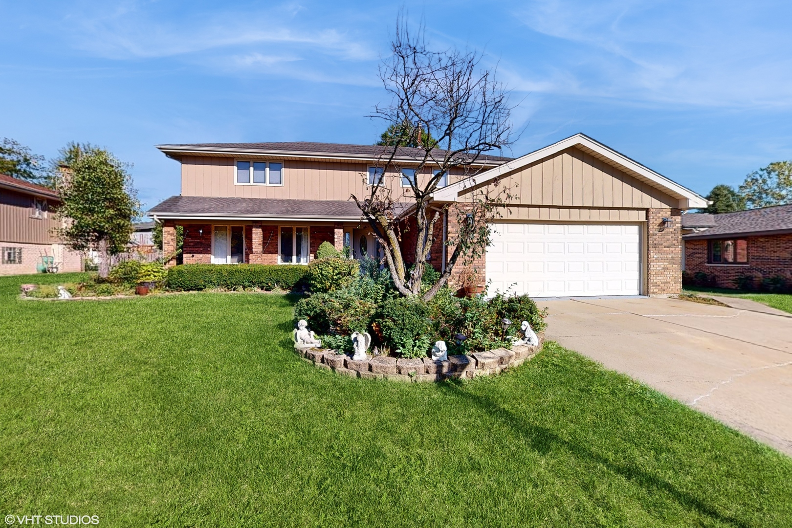 a front view of a house with garden