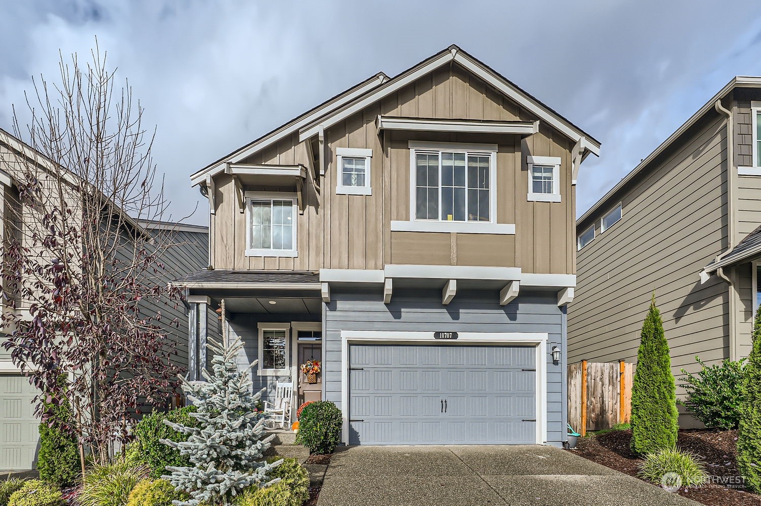 a front view of a house with garage