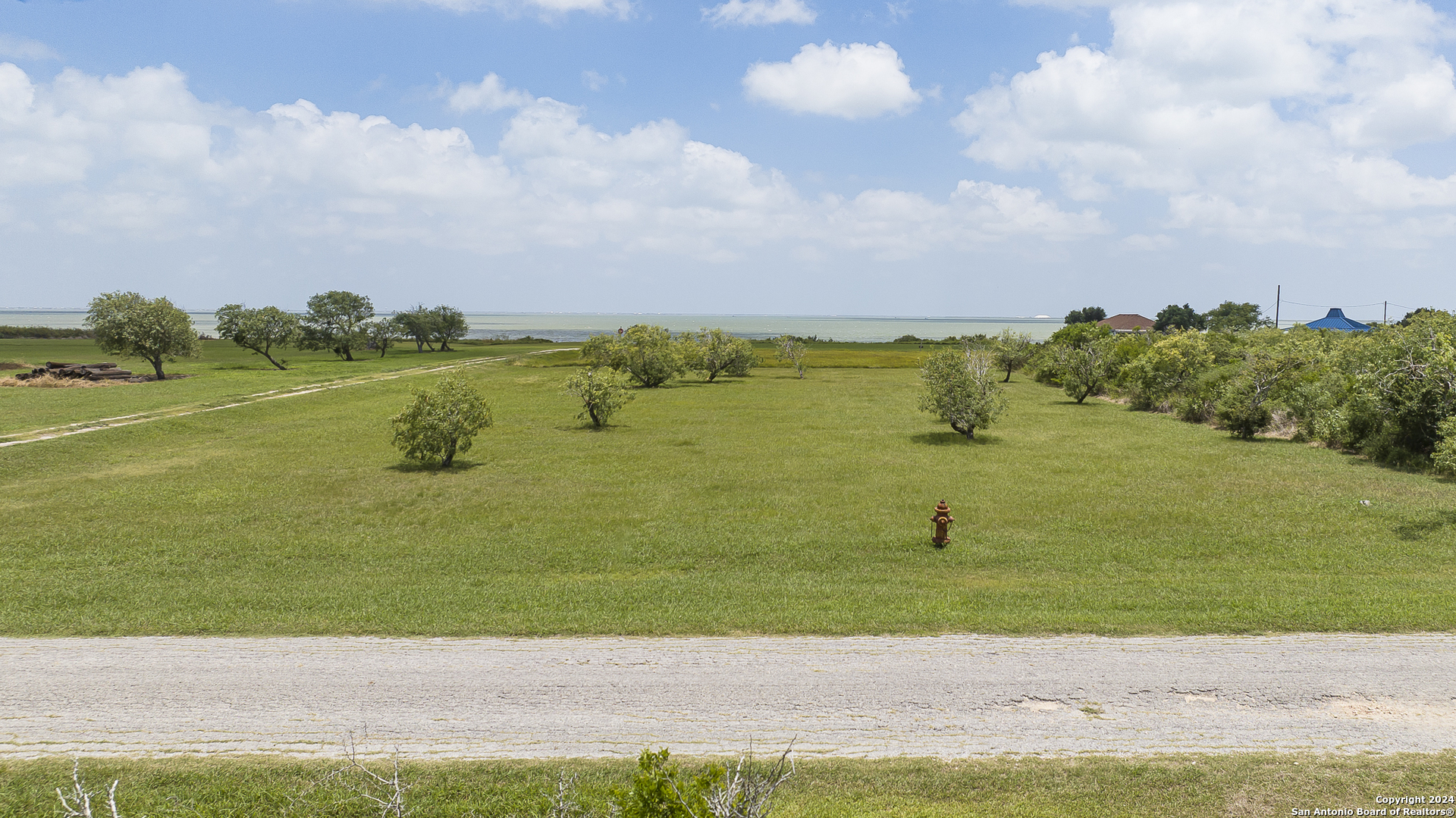 a view of a lake with a big yard