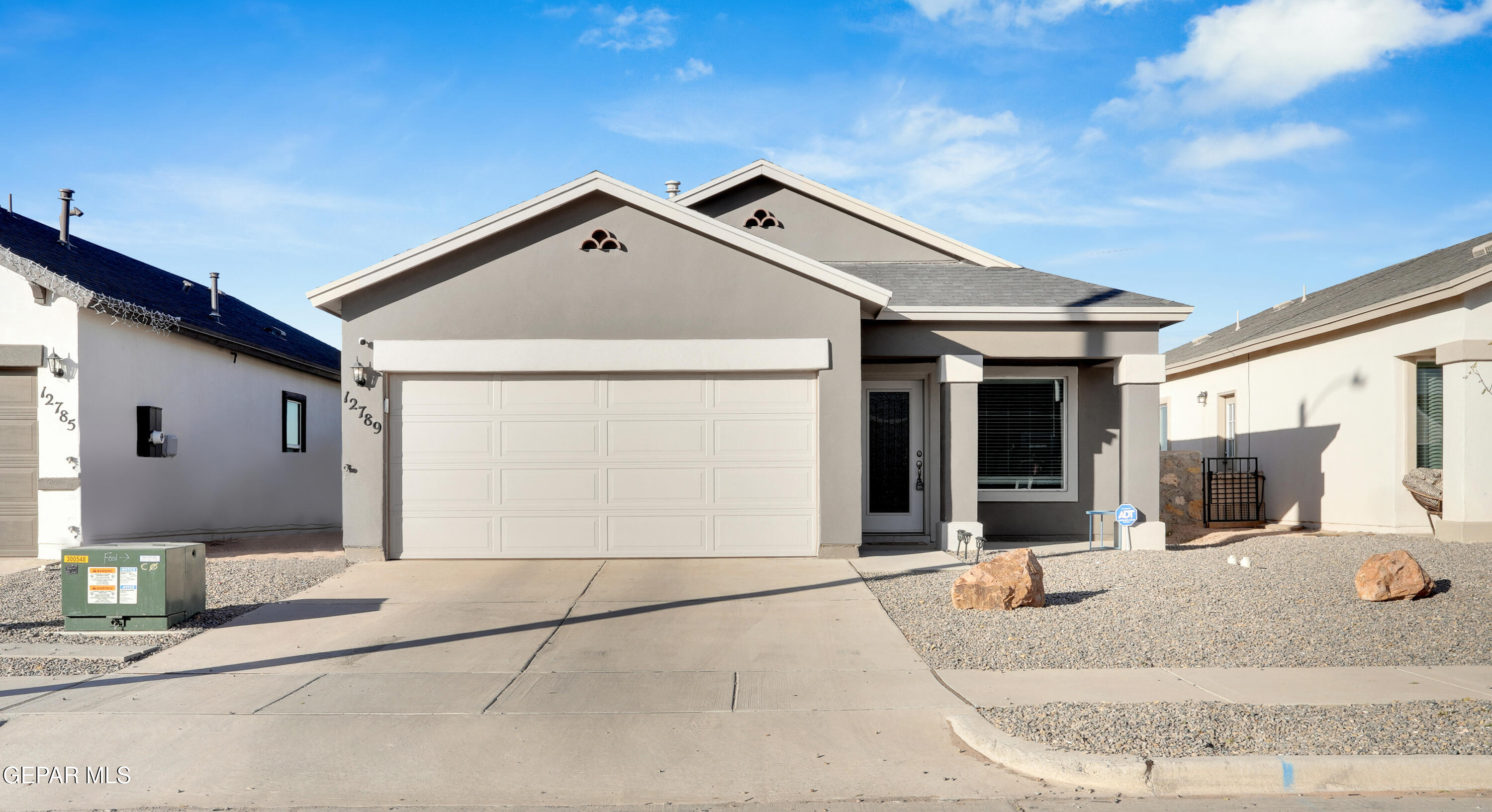 a front view of a house with a garage