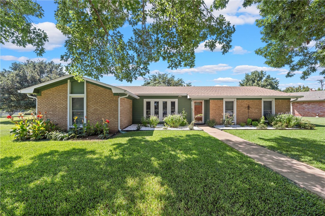 front view of a house and a yard