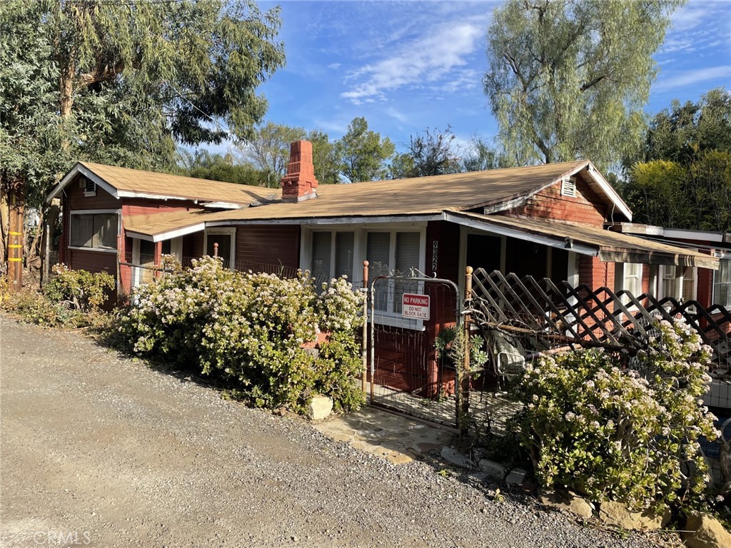 front view of a house with a garden