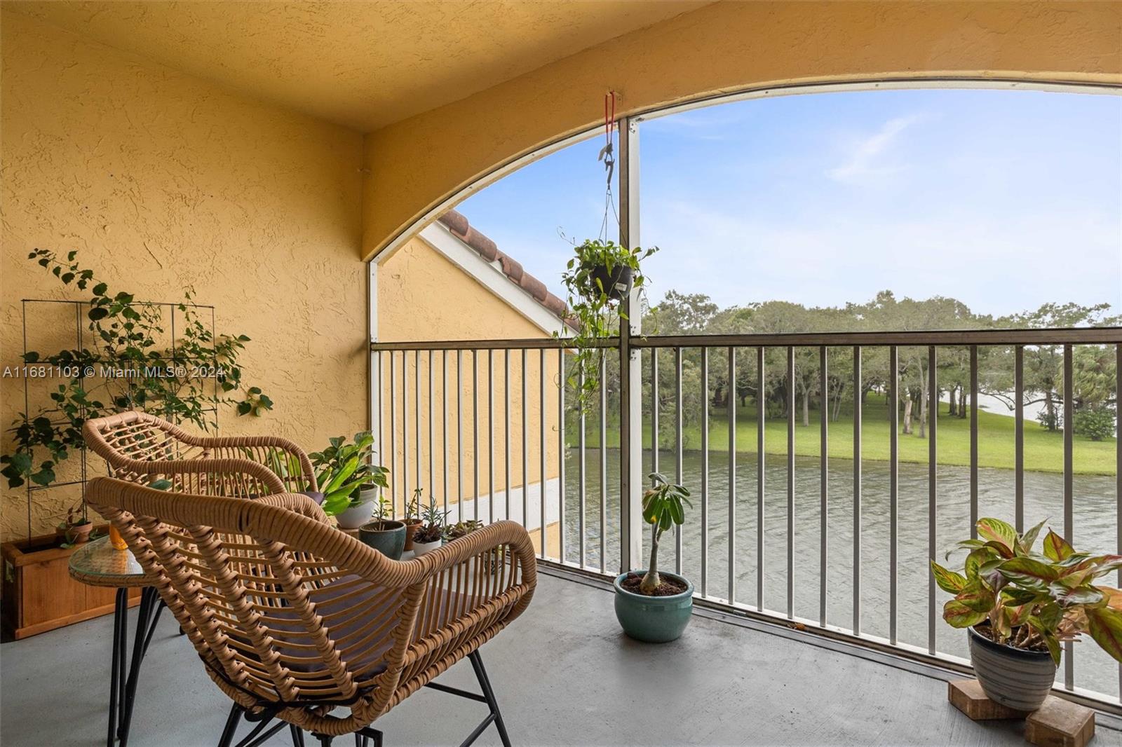 a view of a balcony with furniture