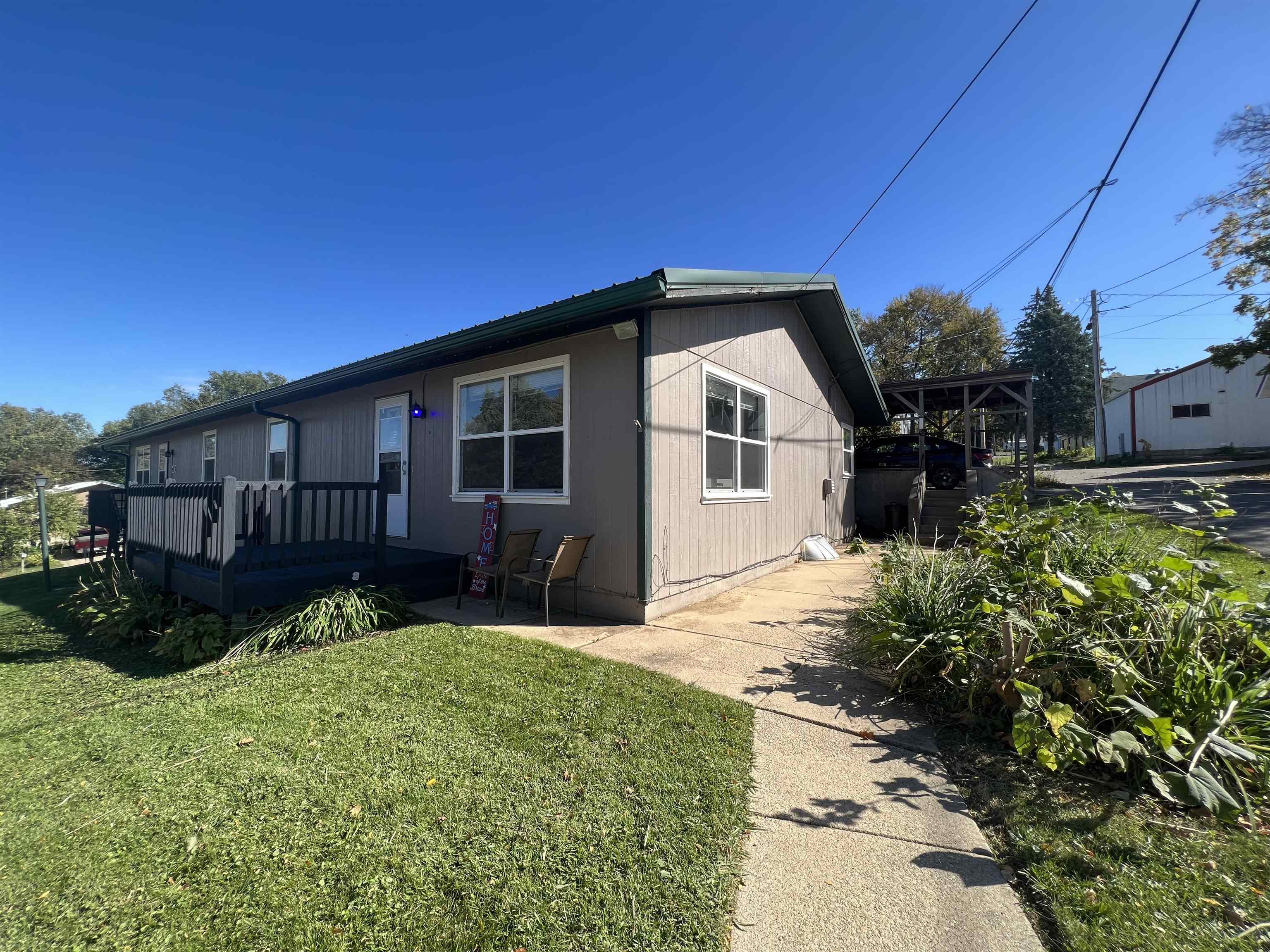 a view of a house with wooden fence