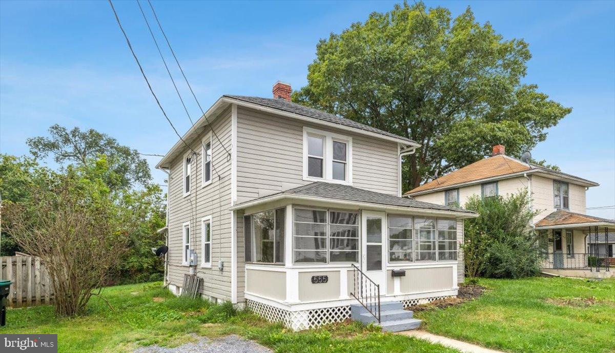 front view of a house with a yard