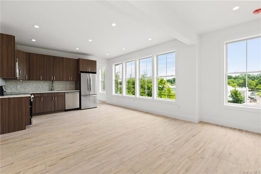 a view of kitchen and wooden floor