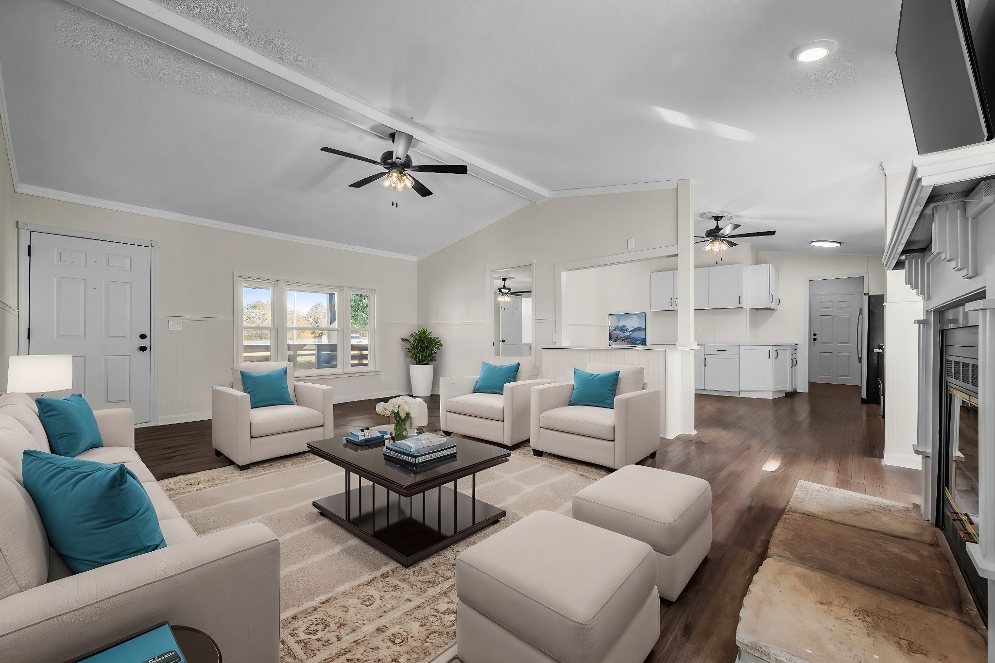 a living room with furniture and a wooden floor