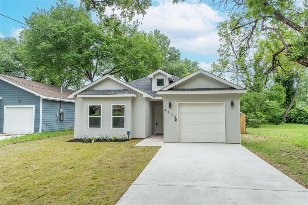 a front view of a house with yard