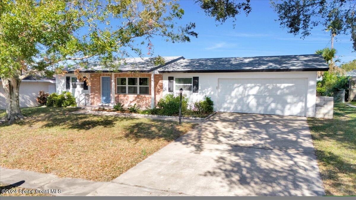 front view of a house with a yard