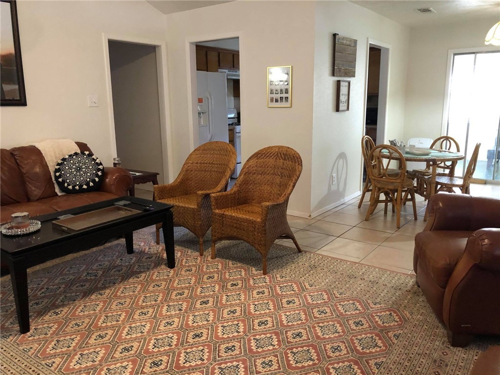 a living room with furniture and a rug