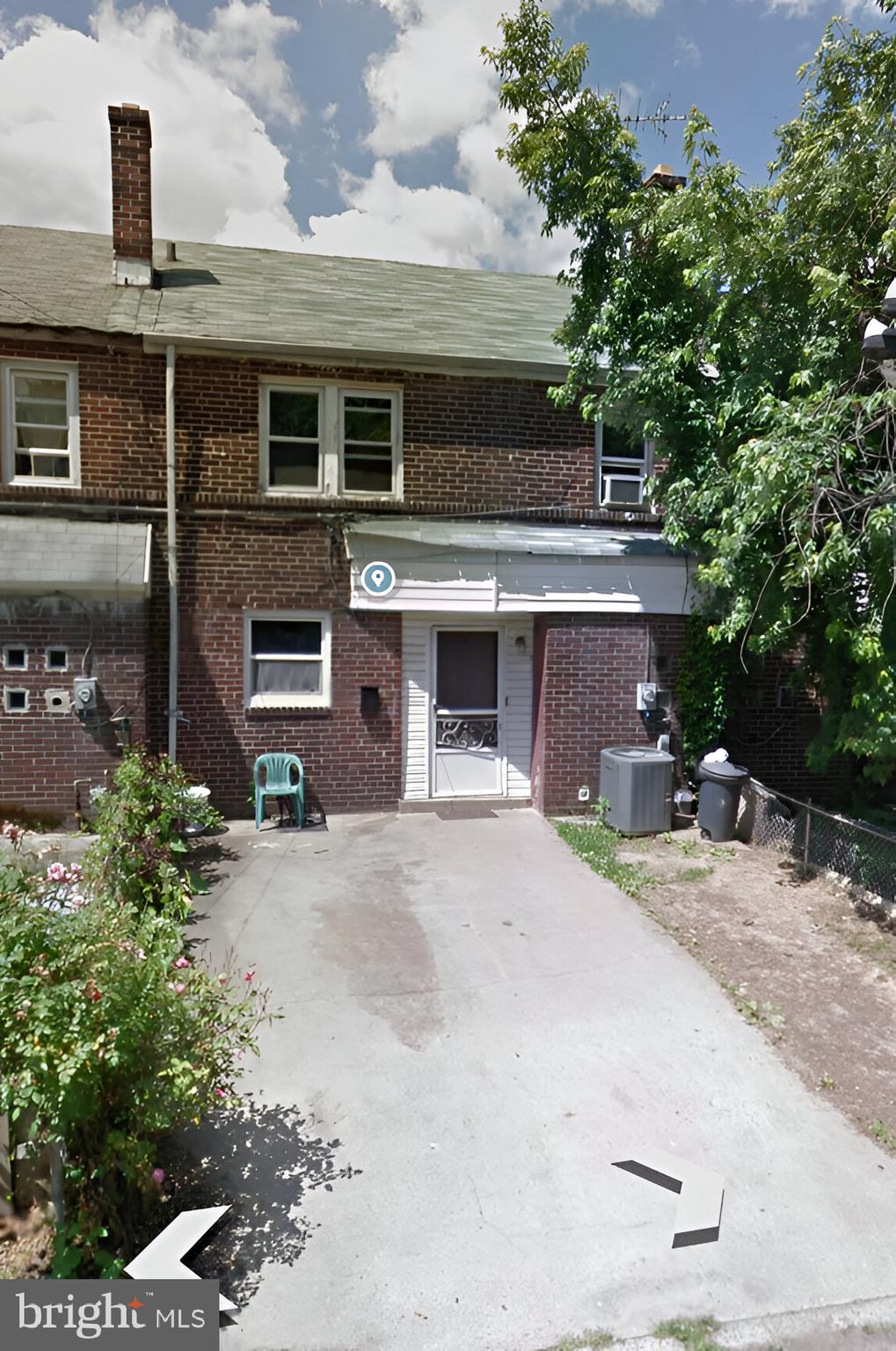 a front view of a house with a yard and a garage