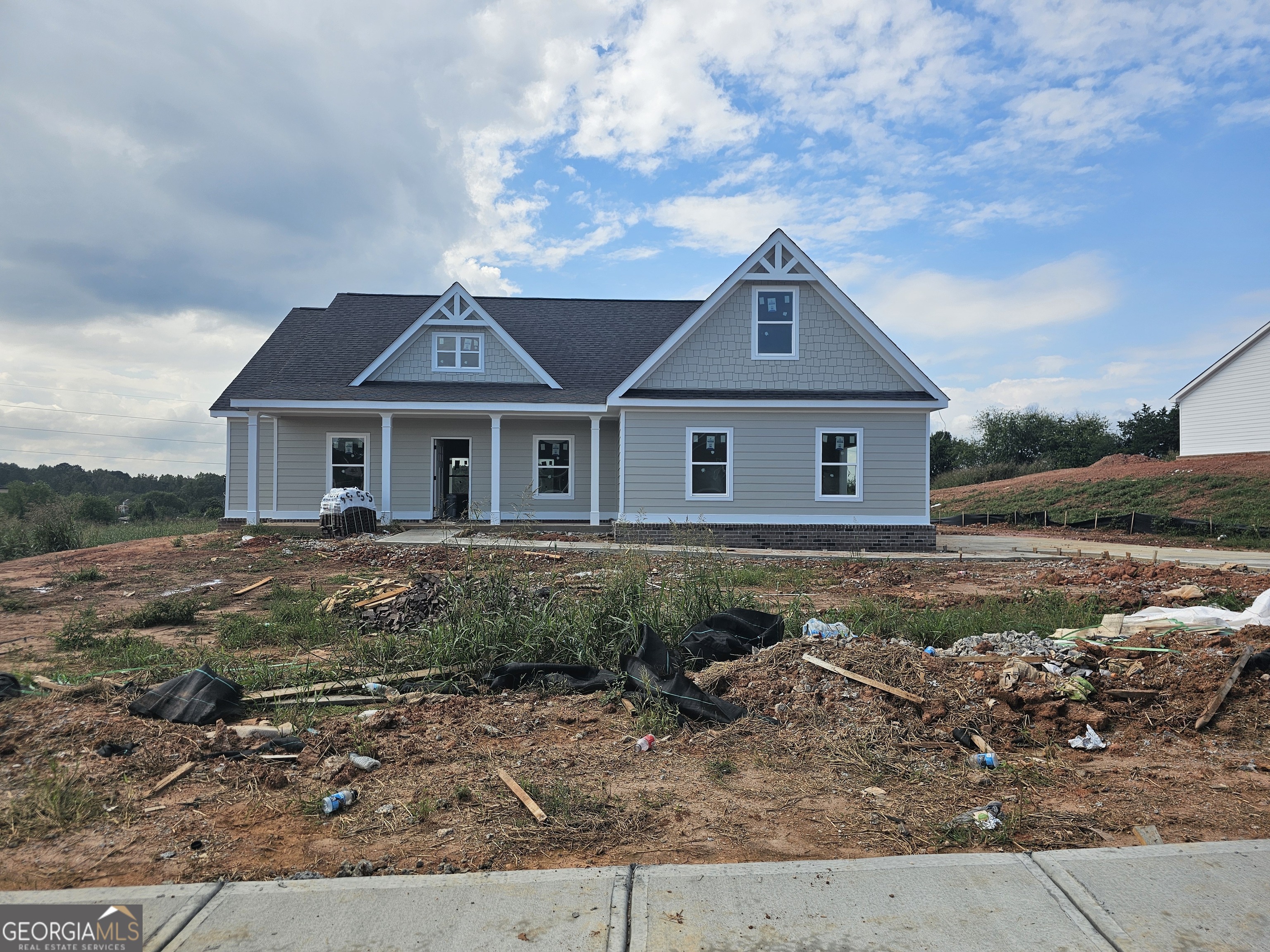 a front view of a house with a yard