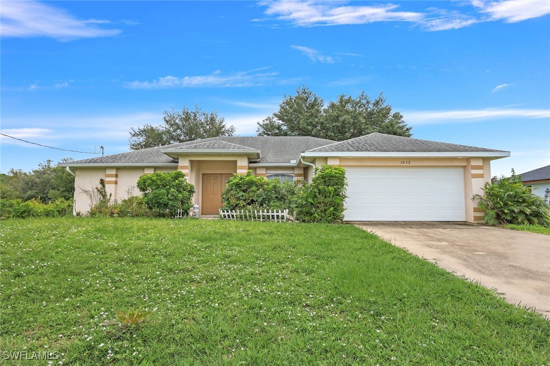 front view of a house with a yard