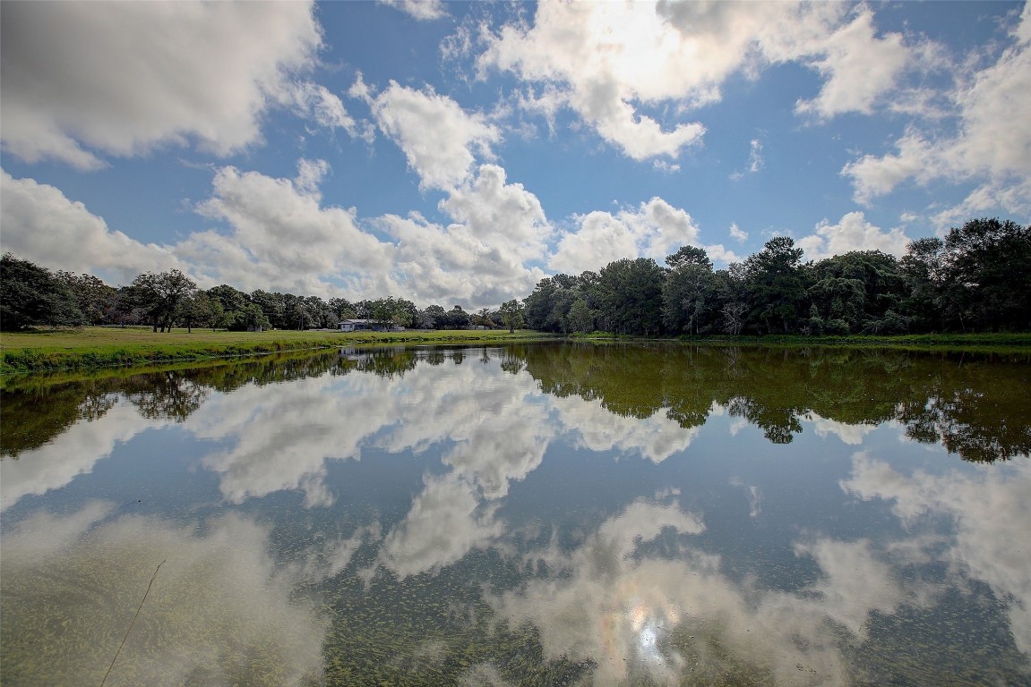 a view of a lake with a big yard