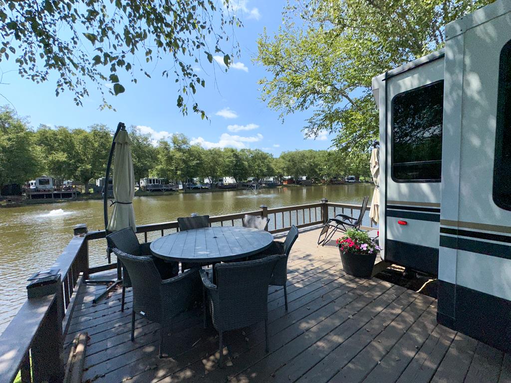 a view of a lake with sitting area