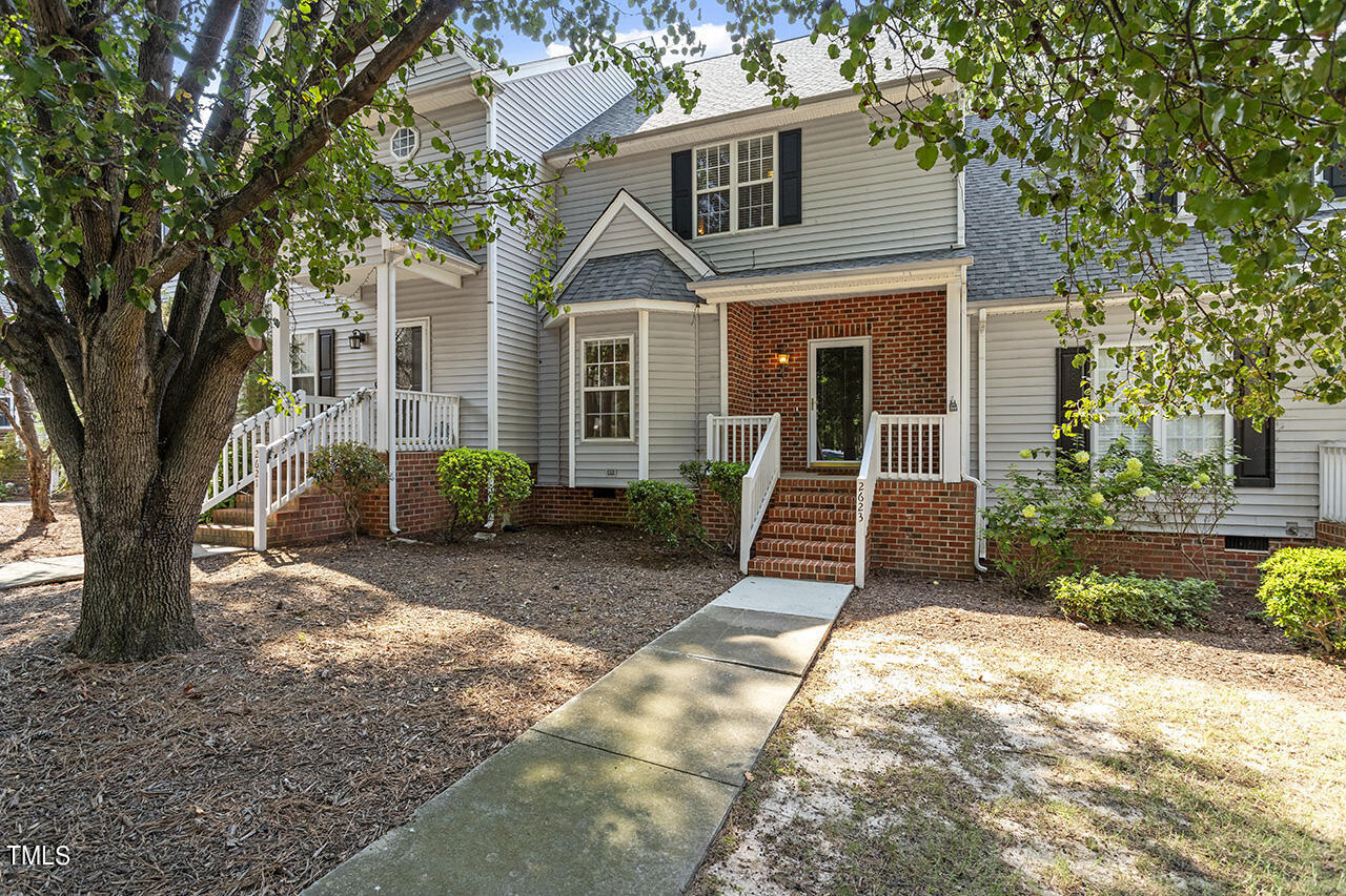 a front view of a house with yard