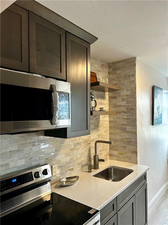 a kitchen with a sink and cabinets