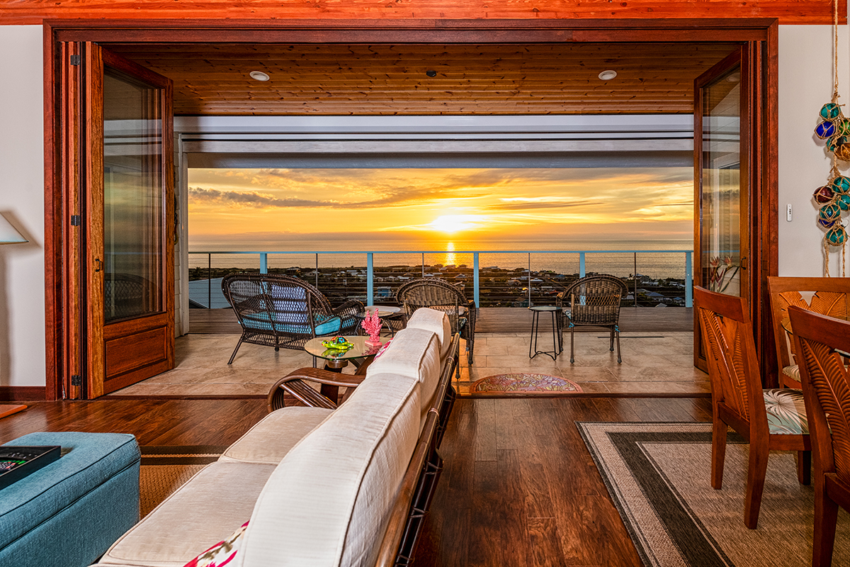 a view of a balcony with floor to ceiling windows with wooden floor