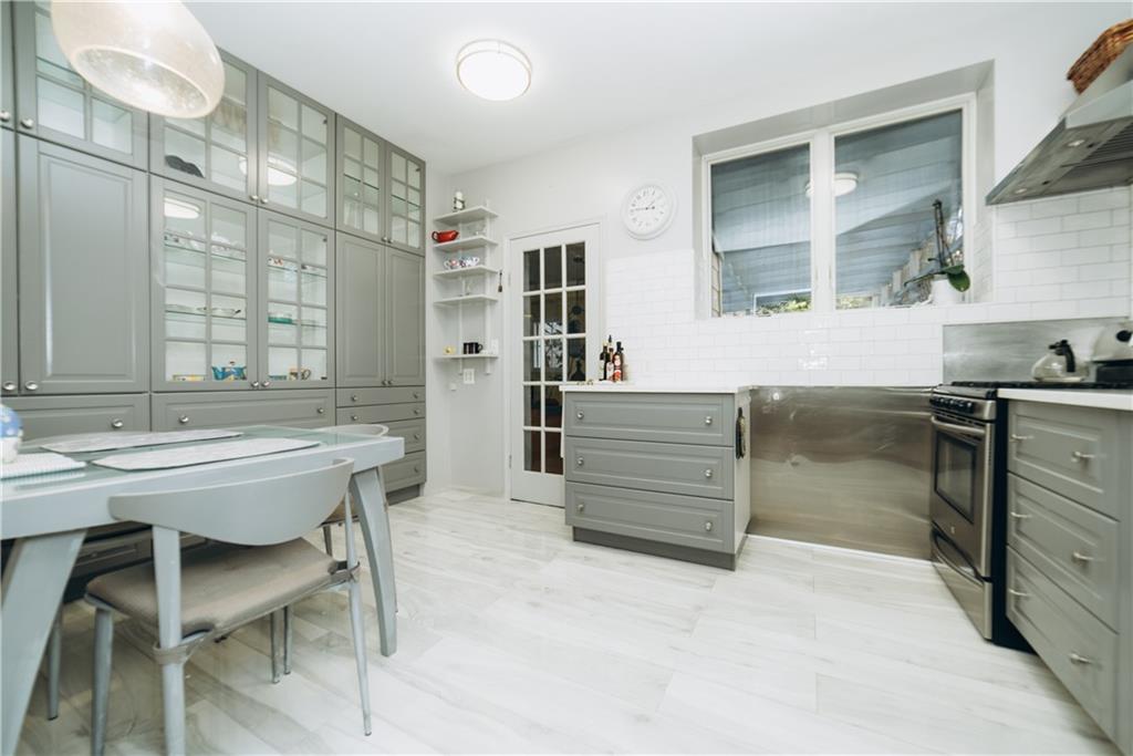 a kitchen with a table and chairs