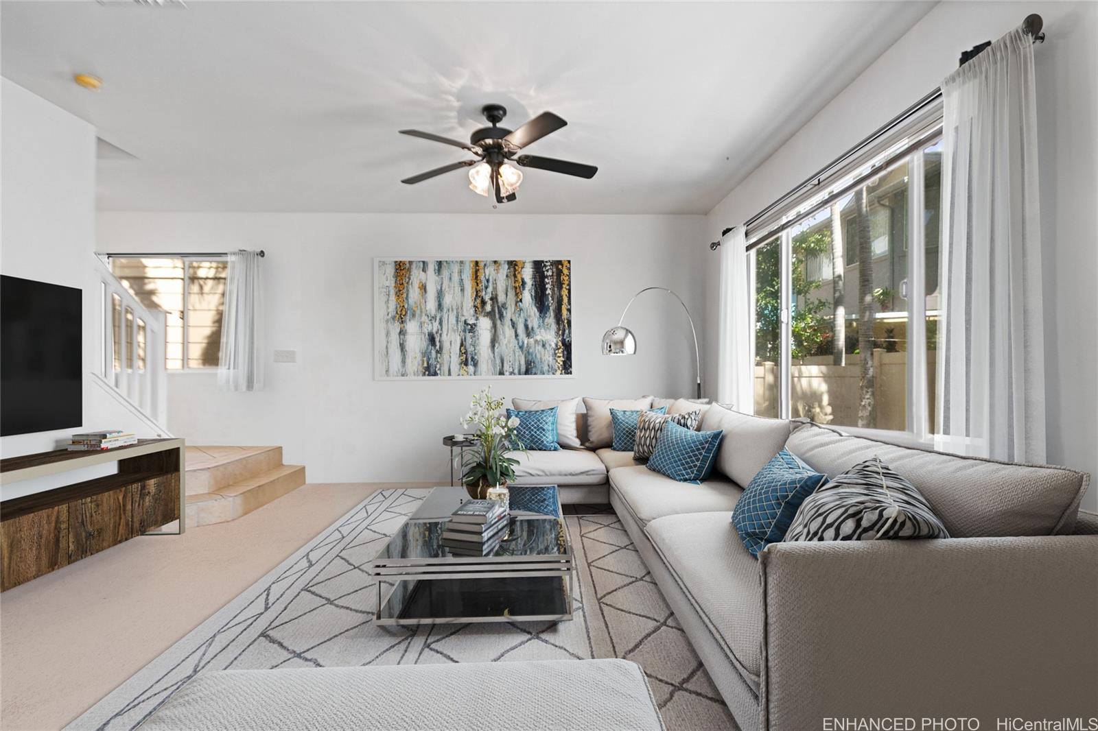 a living room with furniture and a flat screen tv