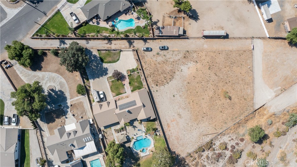 an aerial view of a house with a swimming pool