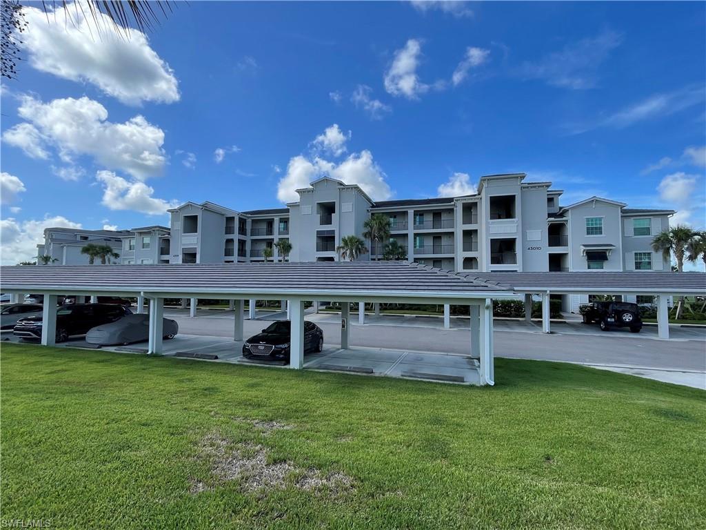 a view of a large building with a big yard