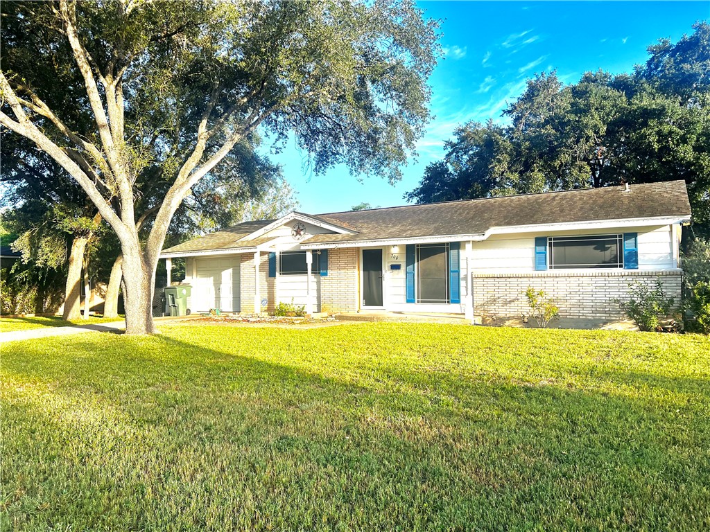 front view of a house with a yard