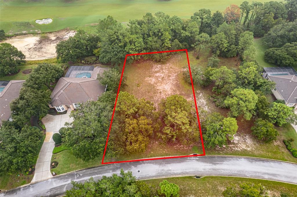 an aerial view of a houses with yard