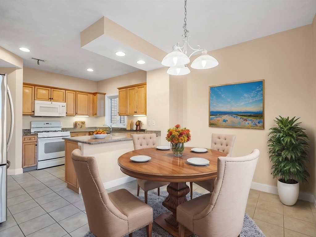 a kitchen with a table and chairs