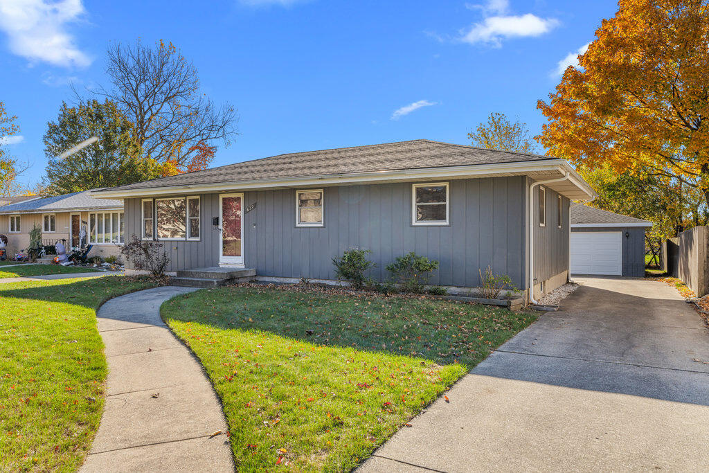 a view of a house with a yard patio and a patio