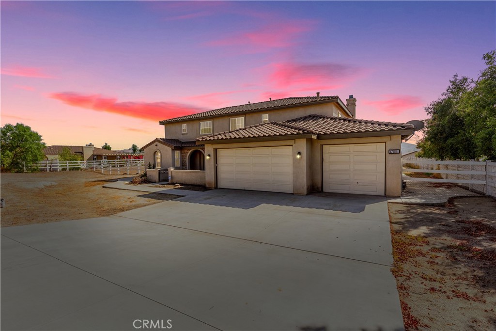 a front view of a house with a garage