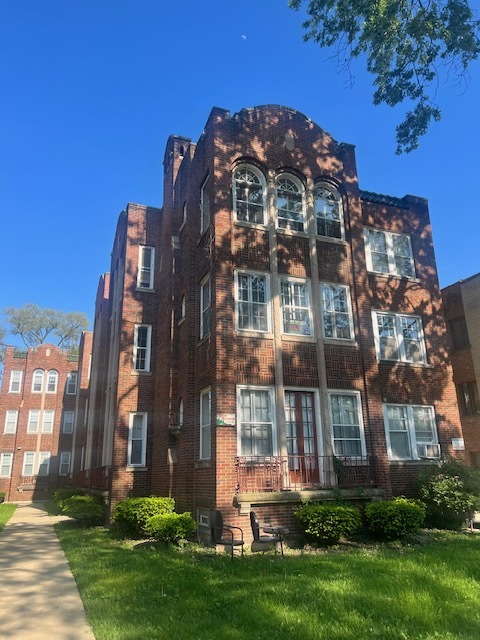 front view of a building with a yard