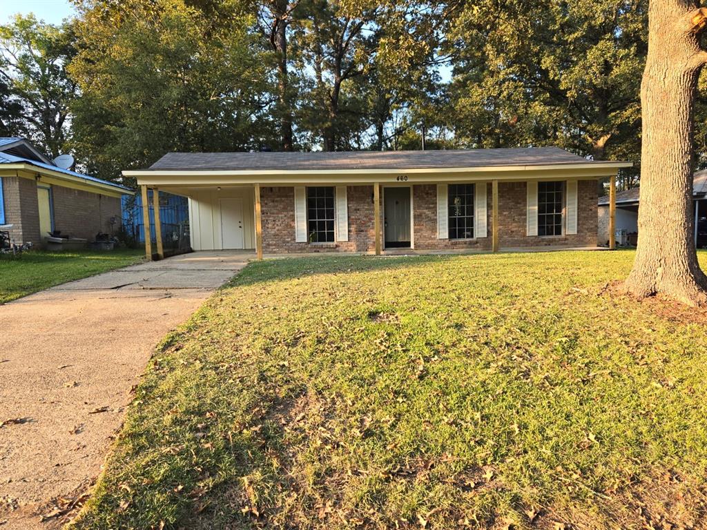 front view of a house with a yard