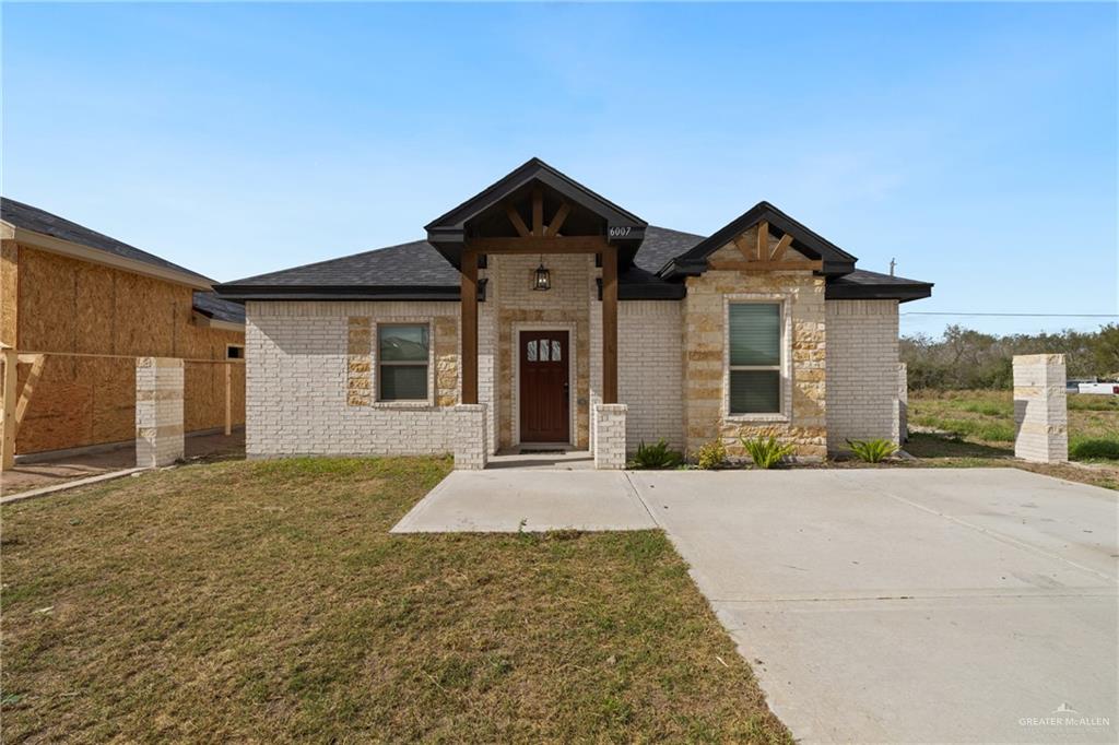 a front view of a house with yard