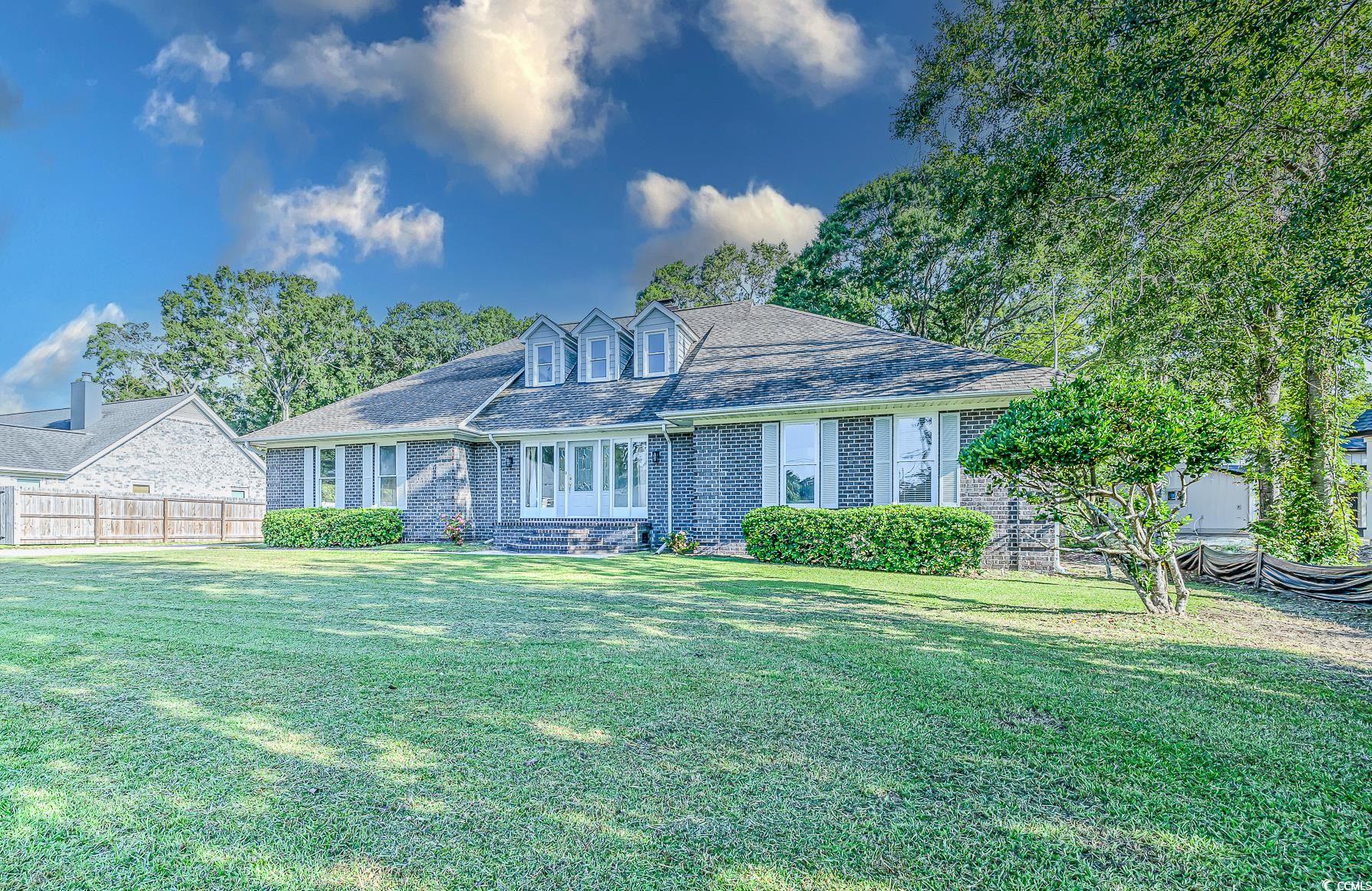 View of front of property featuring a front yard