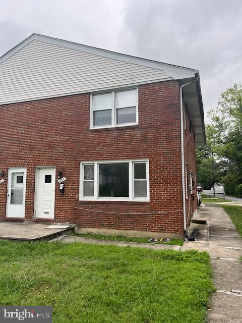 a brick house with a yard